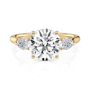 18K Yellow Gold Round and Pear Flush Fit Three Stone 18K Yellow Gold Round and Pear Flush Fit Three Stone